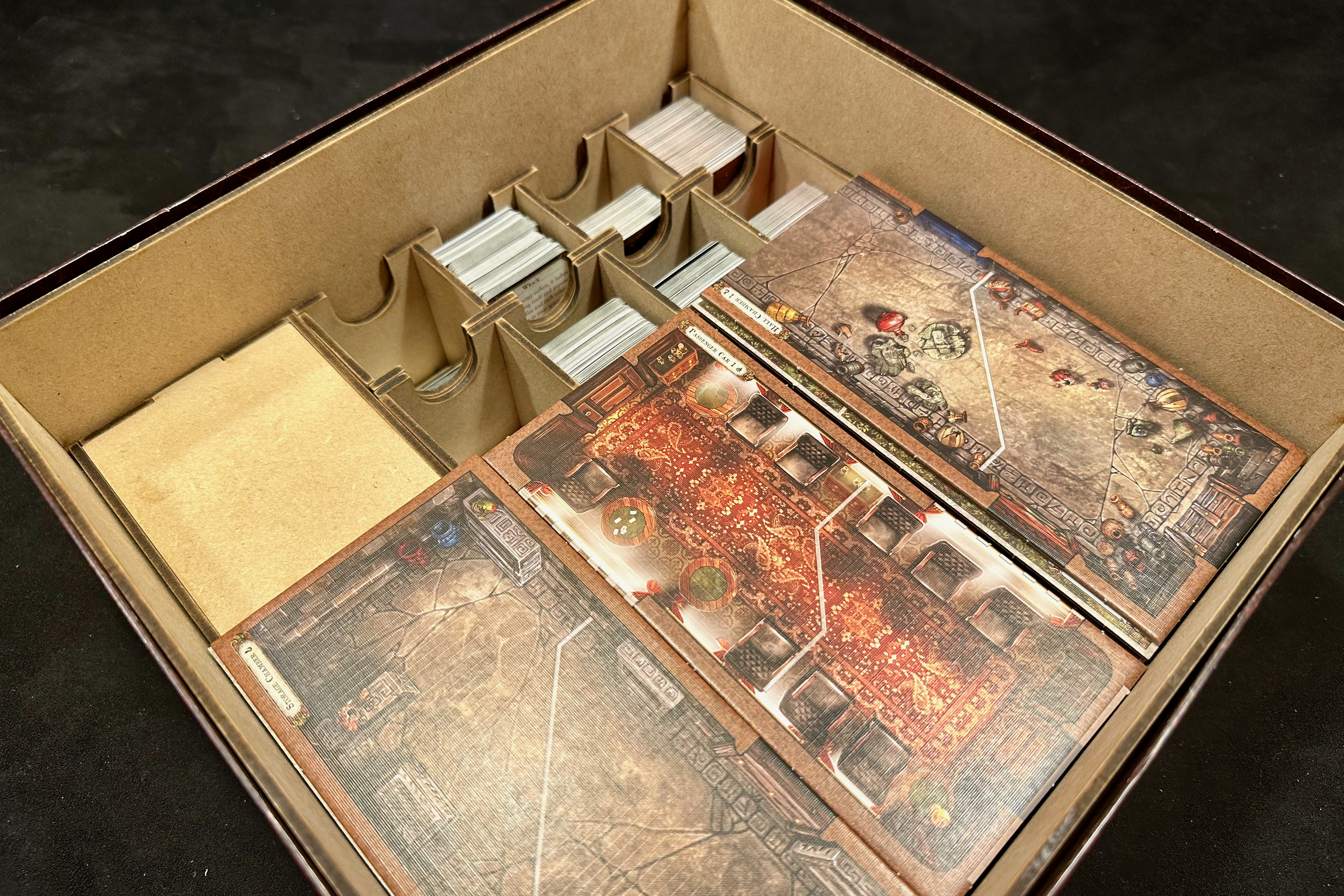 Game box filled with tiles and completed organisers